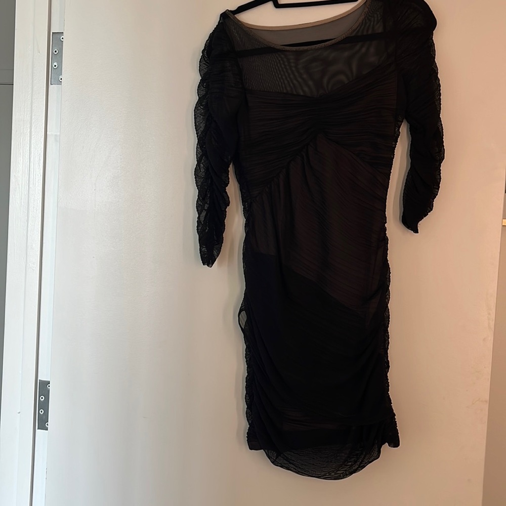 Black dress with sheer detail. Stretchy flattering fabric